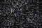 Black pretzel on a dark blue background texture