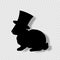 Black profile silhouette of fluffy rabbit in magic top hat