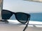 Black protective sun-protective plastic glasses hang on beryl aboard a tourist vessel, yacht and sailboat, boat, liner at the reso