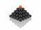 Black pyramid with red ball