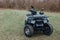 black quad bike on green grass