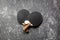 Black racket for ping pong ball gray background top view