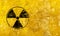 Black radioactive sign over yellow background