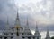 Black rain cloud over white Chedi