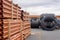 Black rainwater storage tanks placed in a an industry warehouse with orange water pipes in foreground