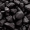 Black raw coal dark background. Fuel fossil material