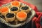 Black and red caviar tartlets, appetizer canapes on silver tray