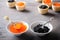 Black and red caviar tartlets, appetizer canapes in white bowls