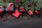 Black and red christmas gift box with red ribbon and fir bran