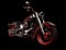 Black and red classic motorcycle cruiser chopper on a black background