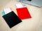 Black and red, differnt color of two passports with blank cover with two flight tickets.