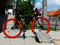 black and red modern bicycle in parked position. flat side view.