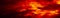 Black red orange sky with clouds. Fire and smoke effect. Night. Dramatic skies background with space for design. Web banner.