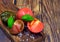 Black and red tomatoes on wooden board