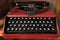 Black and Red vintage metal keyboard machine