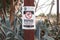 A black, red and white Warning, Do Not Drink Untreated Water sign on a rusty metal pole