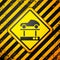 Black Repair car on a lift icon  on yellow background. Repair of the underbody, suspension, wheels and engine