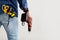 Black repairman holding electric drill in hand, in pocket measuring tape, screwdriver and scissors, copy space