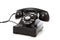 A black retro rotary phone on a white background