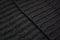 Black ribbed woolen textile edges diagonal