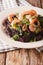 Black rice with shrimp, calamari, mussels and scallops closeup.