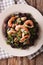 Black rice with shrimp, calamari, mussels and scallops closeup.