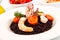 Black rice with squid , prawns and tomatoes