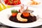 Black rice with squid , prawns and tomatoes