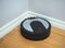 Black robotic vacuum cleaner.