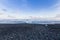 Black rock and sand beach coastline winter season landscape