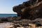 Black rocks of Costa Calma beach. Blue coastline. Playa Barca, Fuerteventura, Canary islands, Spain. Istmo de la pared