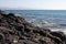 Black rocks of Costa Calma beach. Blue coastline. Playa Barca, Fuerteventura, Canary islands, Spain. Istmo de la pared