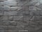 Black rough and solid stone block wall pattern for background