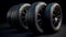 Black round car tires with rubber tread on alloy wheels. AI generated