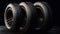 Black round car tires with rubber tread on wheels on a black background. AI generated
