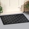 Black Rubber Ellipse Design Eyes Floor Door Mat outside home with yellow flowers and leaves