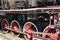 Black rusty vintage steam train on a platform