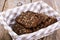 Black rye bread with cereal seeds on white background