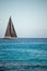 Black sailing yacht on the open sea