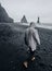 Black sand beach in Iceland. Man on blacksand