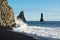 Black sand beach with ocean waves and Reynisdrangar rocks at winter, Iceland