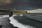 Black Sand Beach Reynisfjara in Iceland. Windy Morning. Ocean Waves. Colorful Sky