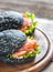 Black sandwich with salmon