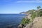 Black Sea coast with dilapidated breakwaters. Abandoned resort. Beautiful blue sea