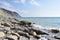 the Black Sea. The outskirts of Anapa. Mountains and rocks, pebble beach.