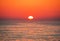 Black Sea at sunset. Large yellow sun under the sea surface. Sochi, Russia