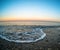 Black sea view on puddle beach in Yalta on sea shore in the evening, in Crimea