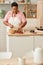 Black senior woman cooking in cozy home kitchen