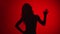 Black shadow portrait woman waving hand hello or goodbye isolated on red. Shot with RED camera in 4K