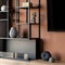 Black shelves with decorations and bio fireplace, close-up